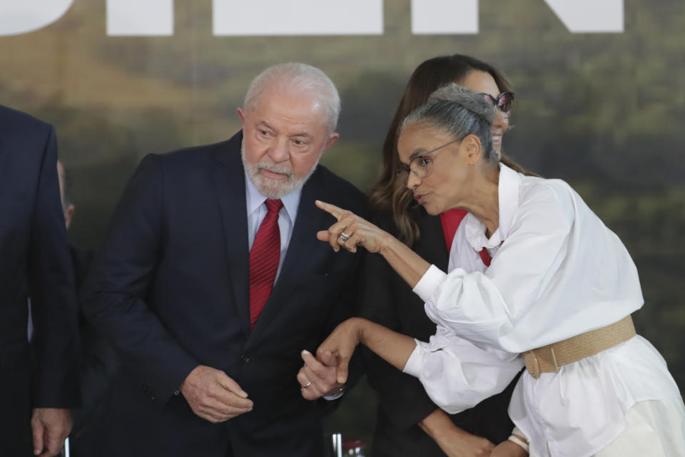 Brazilian President Luiz Inacio Lula da Silva listens to Environment Minister Marina Silva during an event to announce measures to prevent and control deforestation in the Amazon on World Environment Day in Brasilia, Brazil, Monday, June 5, 2023. (AP Photo/Gustavo Moreno)