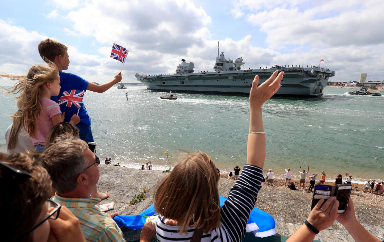 HMS Queen Elizabeth is waved off as she sets sail from Portsmouth Naval Base, for deployment to the United States. (Photo by Gareth Fuller/PA Images via Getty Images)