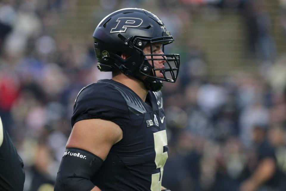 Purdue defensive end George Karlaftis (5) warms up prior to a NCAA football game between the Purdue Boilermakers and the Oregon State Beavers, Saturday, Sept. 4, 2021 in West Lafayette.
