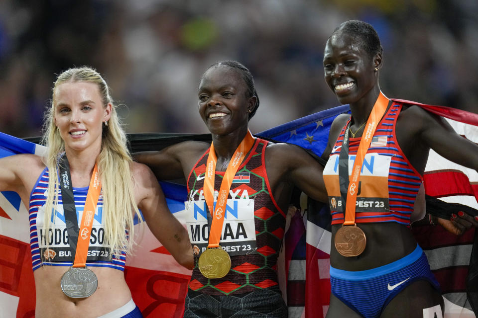 From left: Silver medalist Keely Hodgkinson, of Great Britain, Gold medalist Mary Moraa, of Kenya, and Bronze medalist Athing Mu, of the United States, pose for a picture after the final of the Women's 800-meters during the World Athletics Championships in Budapest, Hungary, Sunday, Aug. 27, 2023. (AP Photo/Ashley Landis)