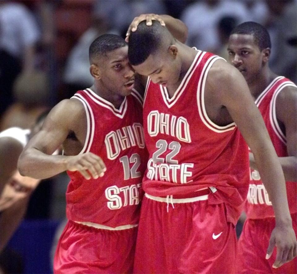 Ohio State's Scoonie Penn, left, encourages teammate Michael Redd just before Redd was to take two free throws during a 77-74 win against St. John's that advanced the Buckeyes to the Final Four.