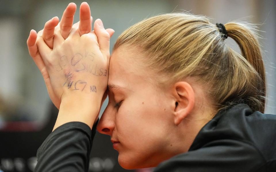 Lexi Dellinger reacts to an athletic trainer massaging a knot in her calf Wednesday, Feb. 1, 2023 at O.C. Lewis Gymnasium at Anderson University in Anderson. 