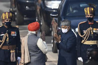 India's Prime Minister Narendra Modi (2L) greets President Ram Nath Kovind as he arrives for the Republic Day parade in New Delhi on January 26, 2021. (Photo by Jewel SAMAD / AFP) (Photo by JEWEL SAMAD/AFP via Getty Images)