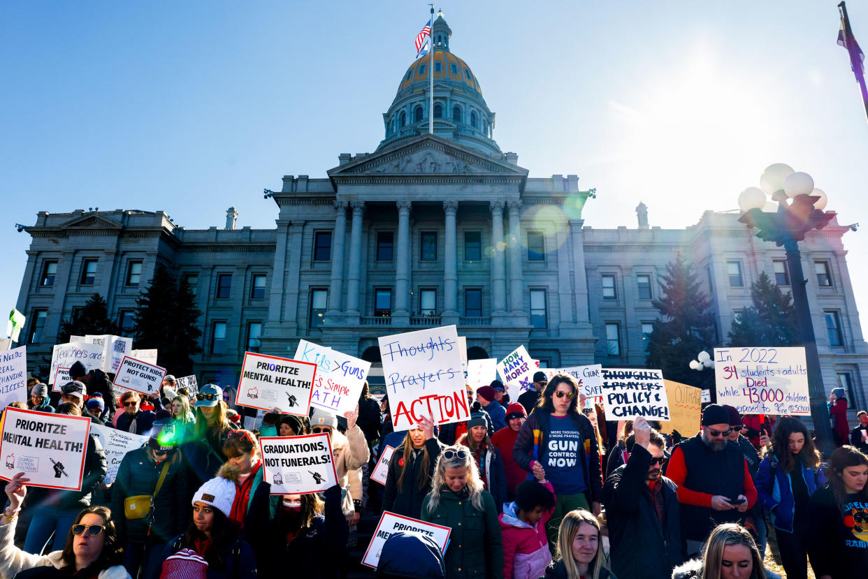 People march around the Colorado State Capitol during a protest to end gun violence