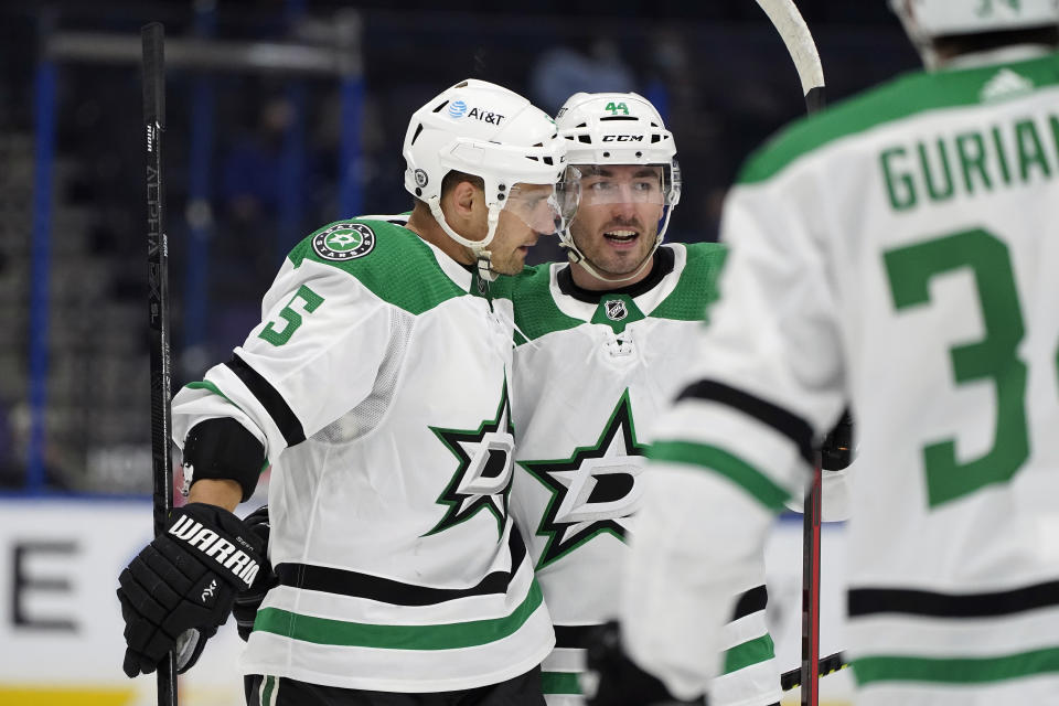 Dallas Stars defenseman Andrej Sekera (5) celebrates his goal against the Tampa Bay Lightning with defenseman Joel Hanley (44) during the third period of an NHL hockey game Wednesday, May 5, 2021, in Tampa, Fla. (AP Photo/Chris O'Meara)