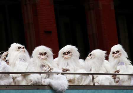 FILE PHOTO: Actors dressed as a 'Yeti' ride aboard a tour bus during a promotional event for Travel Channel's "Expedition Unknown: Hunt for the Yeti" in Manhattan, New York City, U.S. on October 4, 2016. REUTERS/Brendan McDermid/File Photo