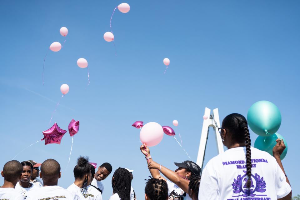 Family and friends gather in Chicago for a balloon release and vigil for Tionda and Diamond Bradley on July 6th, 2021. The sisters, then 10 and 3 years old, disappeared in 2001.