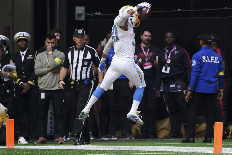 Los Angeles Chargers running back Austin Ekeler celebrates after catching a 1-yard touchdown pass during the first half of an NFL football game against the Atlanta Falcons, Sunday, Nov. 6, 2022, in Atlanta. (AP Photo/John Bazemore)