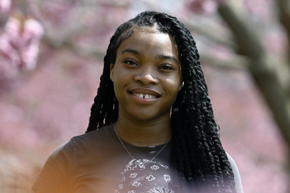 Ashnaelle Bijoux poses on campus, Saturday, April 27, 2024, at Norwich Free Academy in Norwich, Conn. Bijoux, a senior at NFA, has been unable to complete the FAFSA form due to a glitch with the form. Without the form and the financial aid it brings, Bijoux won't be able to pursue her goal of going to Southern Connecticut State University to become a therapist. (AP Photo/Jessica Hill)