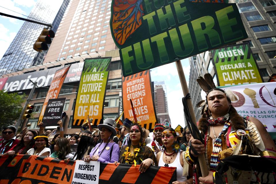 Climate activists prepare to march to voice opposition to the use of fossil fuels, in New York, Sunday, Sept. 17, 2023. (AP Photo/Bryan Woolston)