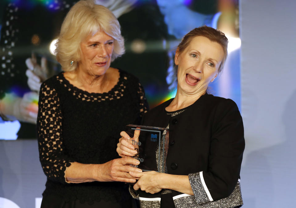 Britain's Camilla, the Duchess of Cornwall presents the Man Booker Prize for Fiction 2018 to British writer Anna Burns during the prize's 50th year at the Guildhall in London, Tuesday, Oct. 16, 2018.(AP Photo/Frank Augstein, Pool)