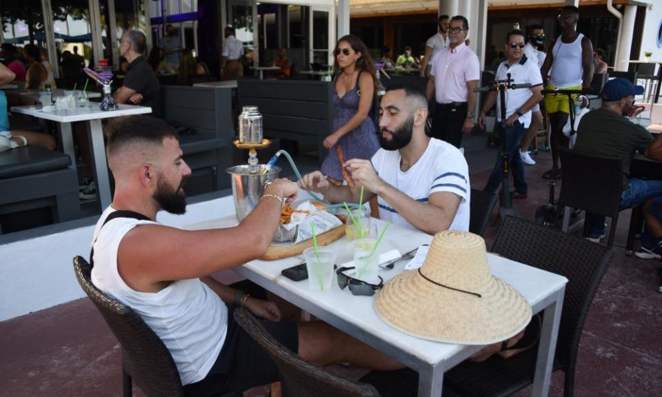 Restaurants and shops are open in Miami Beach, Florida.