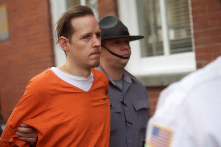 Eric Matthew Frein exits the Pike County Courthouse with police officers after an arraignment in Milford, Pennsylvania, October 31, 2014. REUTERS/Mark Makela/File Photo