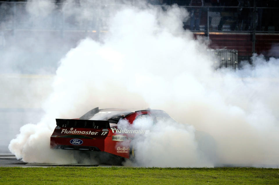 CHARLOTTE, NC - OCTOBER 15: Matt Kenseth, driver of the #17 Fluidmaster Ford, celebrates with a burnout after winning the NASCAR Sprint Cup Series Bank of America 500 at Charlotte Motor Speedway on October 15, 2011 in Charlotte, North Carolina. (Photo by Jared C. Tilton/Getty Images for NASCAR)