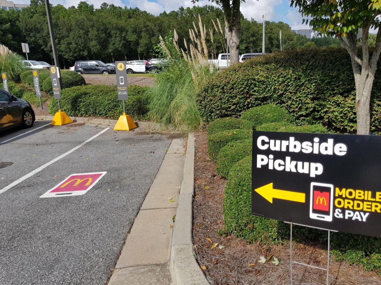 Sign for McDonald's Curbside Pickup on a summer day.