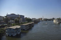 The houseboat belonging to Ikhlas Helmy and others stand moored on the River Nile on June 27, 2022. A government push to remove the string of houseboats from Cairo’s Nile banks has dwindled their numbers from a several dozen to just a handful. Helmy stands to evicted, and the boat moved or demolished. The tradition of living on the Nile River dates back to the 1800s, and the removal of the boats has drawn criticism in Egypt. The government says it plans to develop the waterfront. (AP Photo/Tarek Wagih)