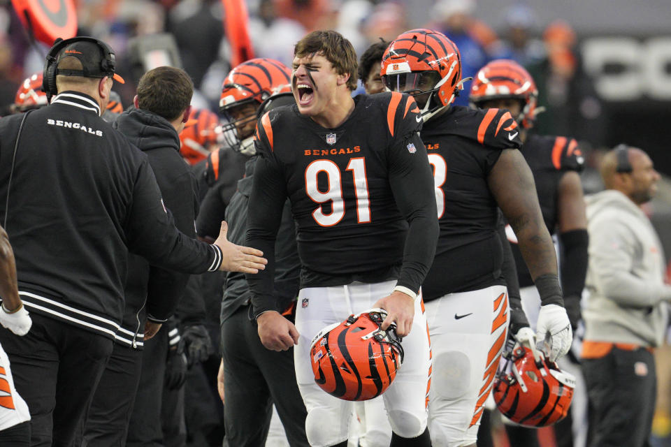 Cincinnati Bengals defensive end Trey Hendrickson (91) celebrates a sack as he comes to the sideline in the second half of an NFL football game against the Indianapolis Colts in Cincinnati, Sunday, Dec. 10, 2023. (AP Photo/Jeff Dean)