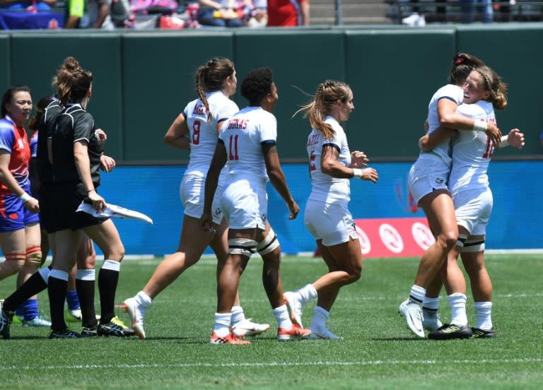 Members of the US team celebrate after their 38-7 win over China during their women's round of 16 games at the Rugby Sevens World Cup in San Francisco