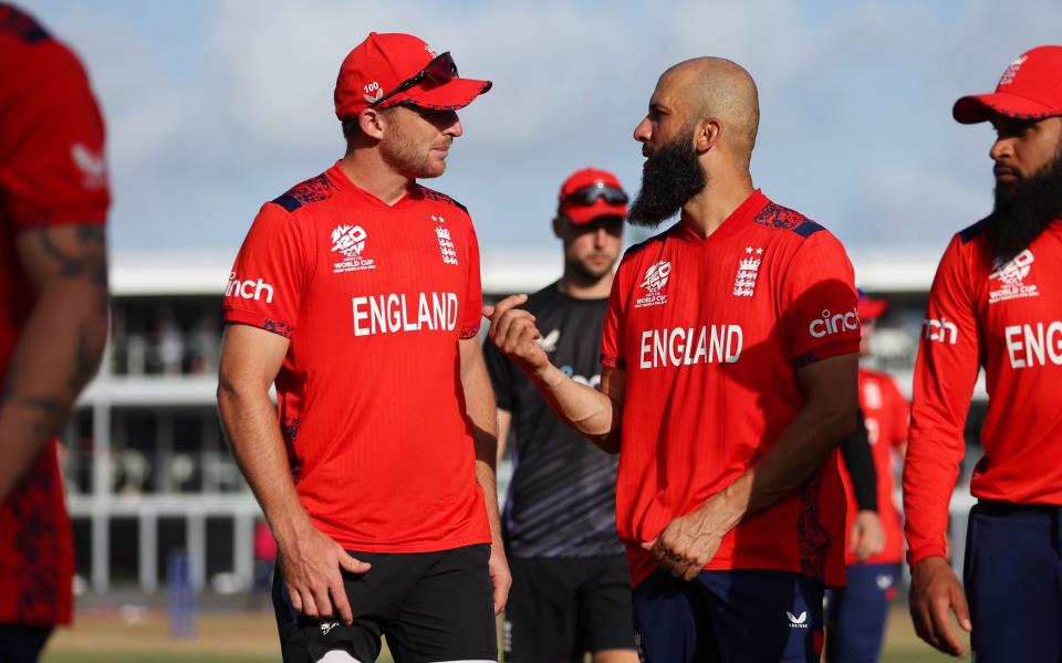 Jos Buttler interacts with teammate Moeen Ali of England after the ICC Men's T20 Cricket World Cup West Indies & USA 2024 match between Australia and England at Kensington Oval on June 08, 2024 in Bridgetown, Barbados