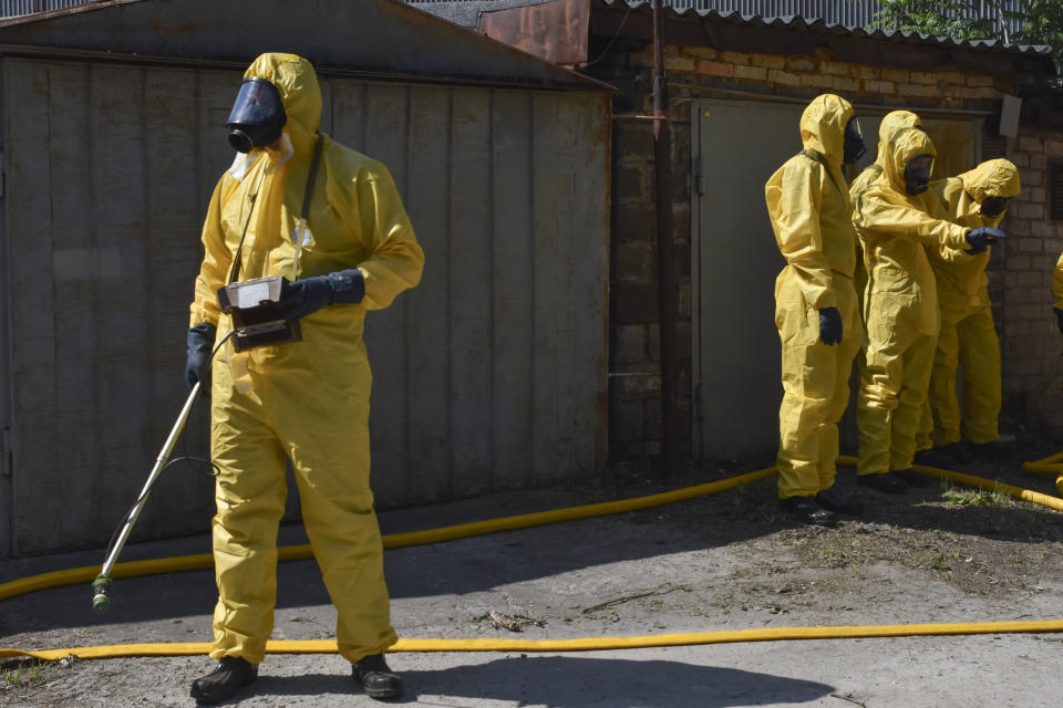 Ukrainian emergency workers wearing radiation protection suits attend training in Zaporizhzhia, Ukraine, Wednesday, June 7, 2023. The Zaporizhzhia Nuclear Power Plant, Europe’s biggest, relies in large part on water from the now-emptying reservoir at the Kakhovka dam. The U.N.’s International Atomic Energy Agency reported “no immediate risk to the safety of the plant,” whose six reactors have been shut down for months but still need water for cooling. (AP Photo/Andriy Andriyenko)