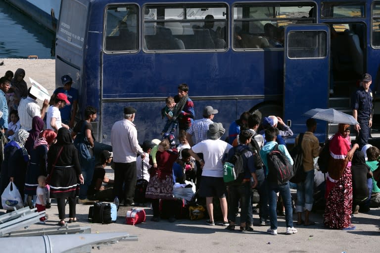 Migrants wait to be transferred to a camp on the Greek island of Lesbos, June 17, 2015