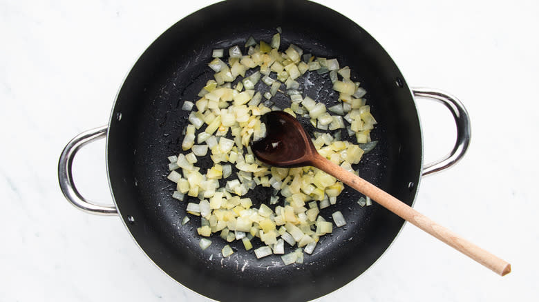 onion frying in soup pot