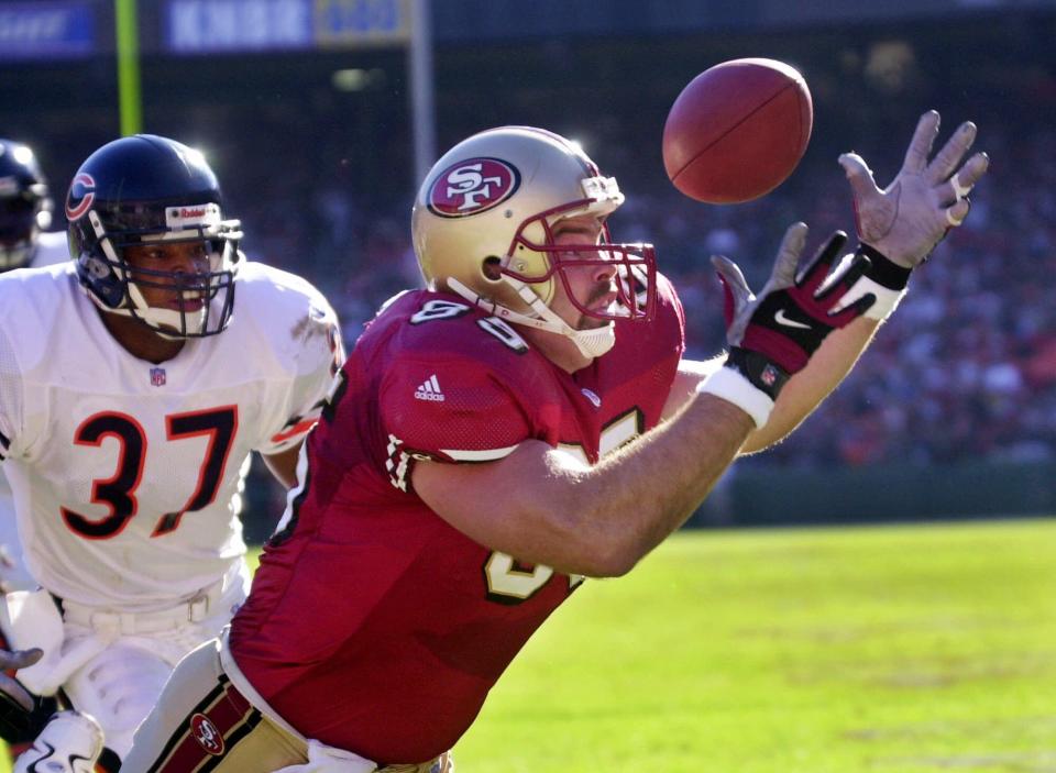 Greg Clark catches a pass for a touchdown against the Bears in 2000.