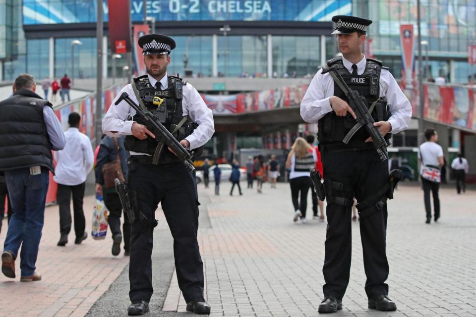 Armed officers surrounded the national stadium ahead of the FA Cup final (PA)