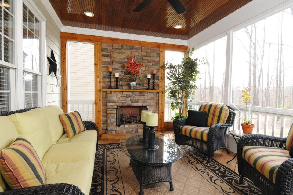 screened in porch ideas fireplace