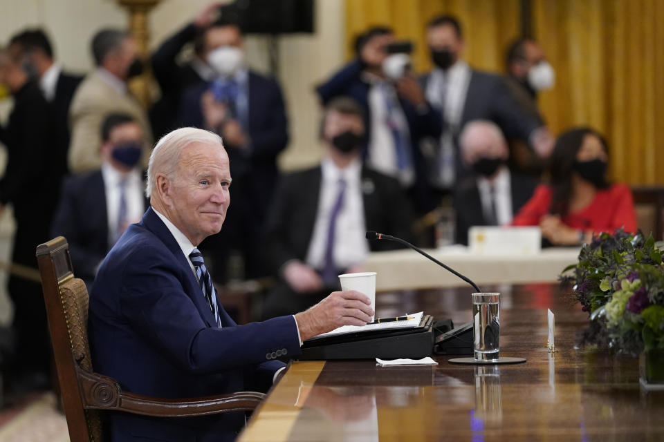 President Joe Biden listens as reporters ask questions as he meets with Mexican President Andrés Manuel López Obrador, right, and Canadian Prime Minister Justin Trudeau in the East Room of the White House in Washington, Thursday, Nov. 18, 2021. (AP Photo/Susan Walsh)