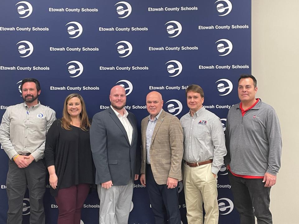 New Southside football coach Ben Stewart takes a photo with Etowah County school employees after his hire became official during a board meeting on Tuesday, March 12, 2024.