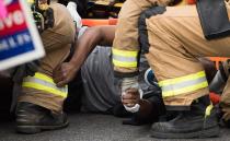 Campaigners lined the corners of an intersection where a man was hit; "I didn't see him" a driver said while talking to police. Photo: AP