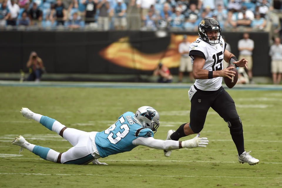 Carolina Panthers linebacker Brian Burns (53) dives for Jacksonville Jaguars quarterback Gardner Minshew (15) during the second half of an NFL football game in Charlotte, N.C., Sunday, Oct. 6, 2019. (AP Photo/Mike McCarn)