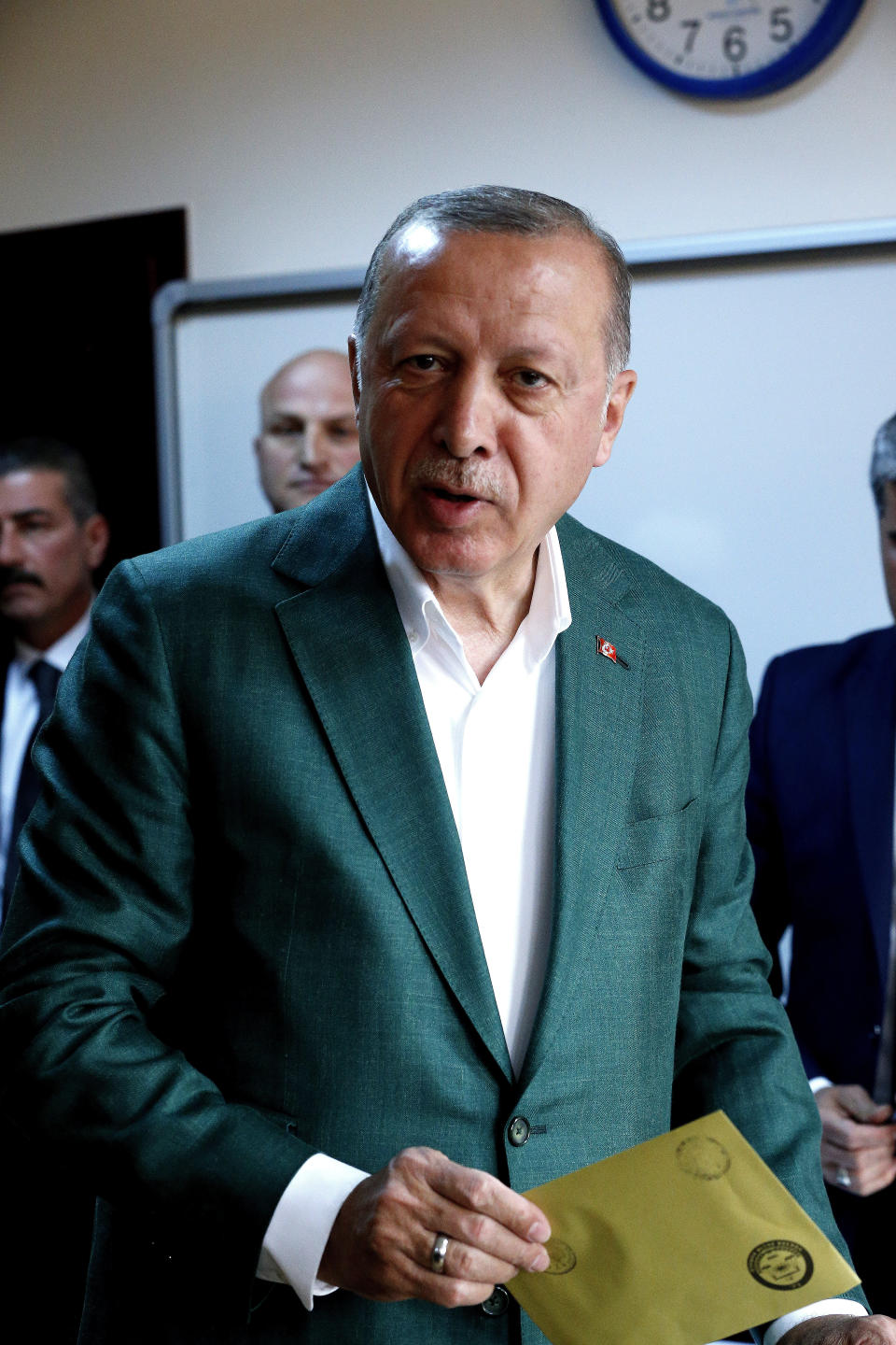 Turkey's President Recep Tayyip Erdogan, casts his ballot during the local elections, in Istanbul, Sunday, March 31, 2019. Mayoral elections are underway in 30 large cities in Turkey along with other municipal races Sunday that are seen as a barometer of President Recep Tayyip Erdogan's popularity amid a sharp economic downturn in the nation straddling Europe and Asia. (AP Photo/Lefteris Pitarakis)