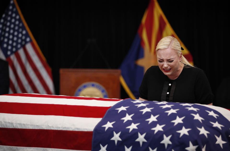 Meghan McCain, daughter of Sen. John McCain, touches the casket during a memorial service at the Arizona Capitol on August 29, 2018, in Phoenix, Arizona. John McCain will lie in state at the Arizona State Capitol before being transported to Washington D.C. where he will be buried at the U.S. Naval Academy Cemetery in Annapolis. Sen. McCain, a decorated war hero, died August 25 at the age of 81 after a long battle with Glioblastoma, a form of brain cancer.