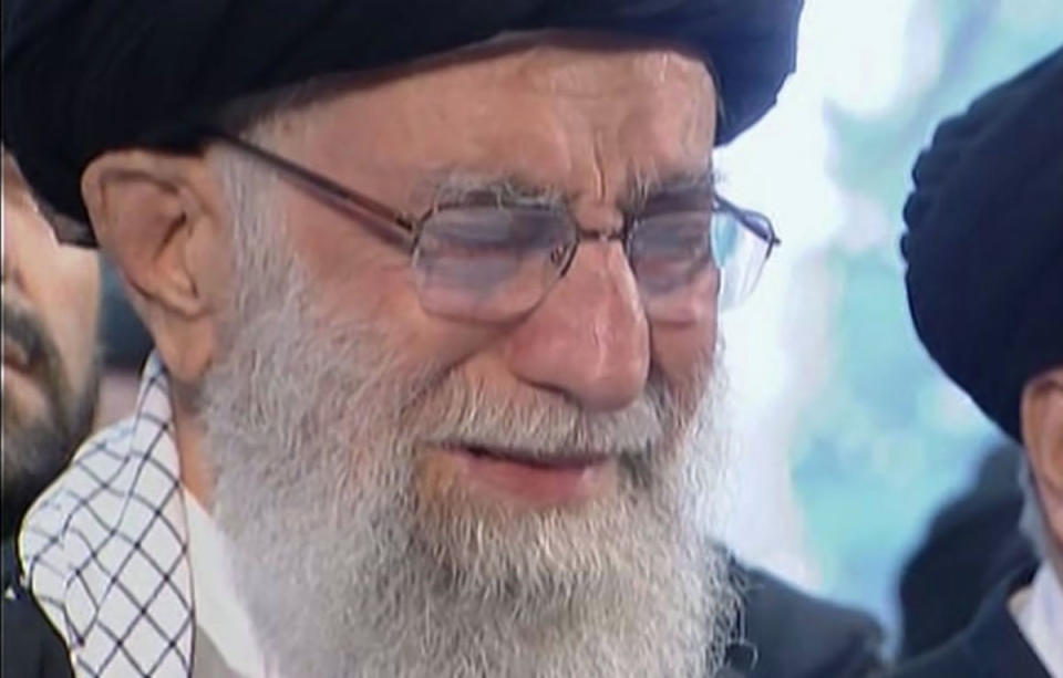 In this image taken from video, Iranian Supreme Leader Ayatollah Ali Khamenei openly weeps as he leads a prayer over the coffin of Gen. Qassem Soleimani, who was killed in Iraq in a U.S. drone strike on Friday, at the Tehran University campus, in Tehran, Iran, Monday, Jan. 6, 2020. (Iran Press TV via AP)