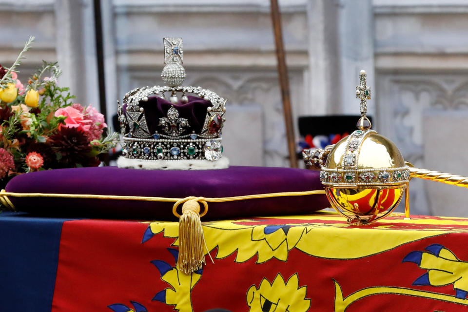 A closeup view of coffin of Queen Elizabeth II, with the Imperial State Crown and orb and scepter resting on top of the Royal Standard, being carried into Westminster Abbey on September 19, 2022. / Credit: Getty Images