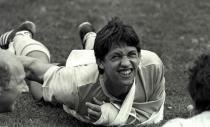 FILE PHOTO: England striker Gary Lineker grimaces as he does stretching exercises with his arm in a sling during the team's training session in Monterrey, Mexico ahead of their World Cup campaign