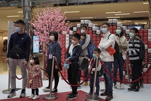 People queue up at a shopping centre in Hong Kong
