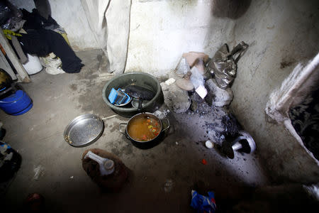 Cooking tools are seen in the shelter of people displaced from the Red Sea port city of Hodeidah in Sanaa, Yemen November 1, 2018. Picture taken November 1, 2018. REUTERS/Mohamed al-Sayaghi