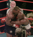 <p>Mike Tyson, left, bites into the ear of Evander Holyfield in the third round of their WBA Heavyweight match at the MGM Grand in Las Vegas. (AP Photo/Jack Smith, File) </p>