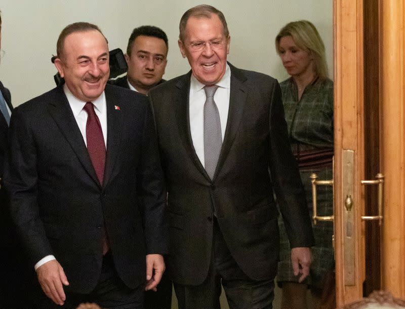 Turkish Foreign Minister Mevlut Cavusoglu and Russian Foreign Minister Sergei Lavrov arrive for a meeting in Moscow