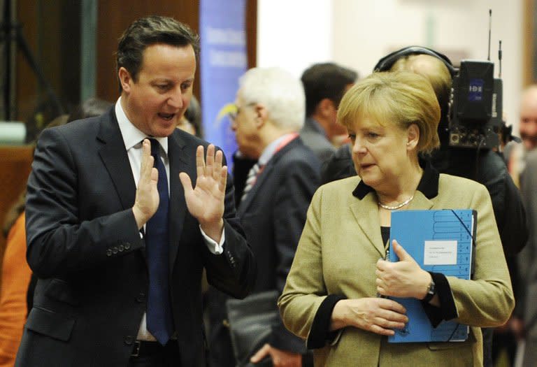 David Cameron and Angela Merkel at EU Headquarters in Brussels on Friday. Europe's leaders wound up another crisis-hit year at their last 2012 summit Friday, trumpeting deals to save Greece and monitor banks but kicking ambitious proposals for further EU integration into a vague future