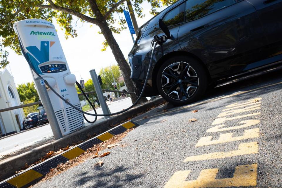 An electric car is seen recharging at an ActewAGL charging station in Canberra, Monday, March 21, 2022. . (AAP Image/Lukas Coch) NO ARCHIVING