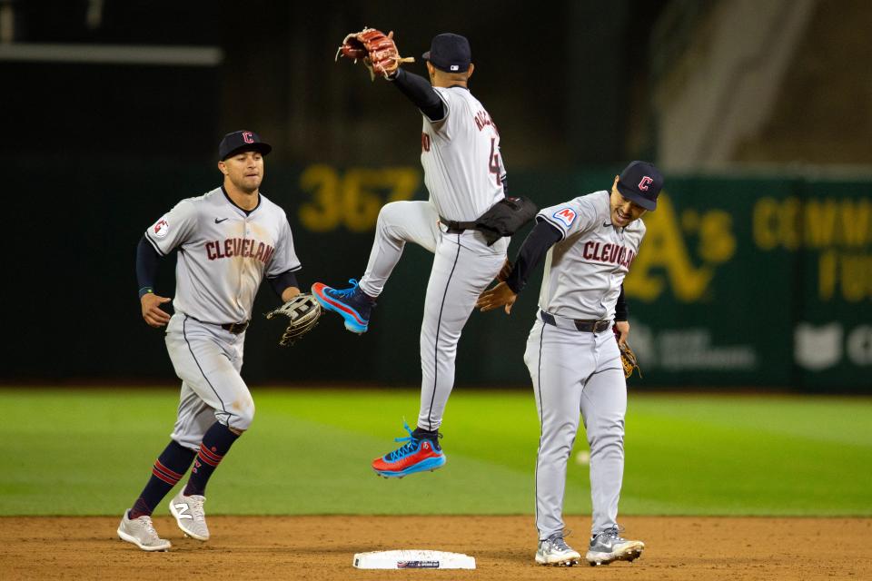 Cleveland Guardians players celebrate their 8-0 Opening Day victory over the Athletics, March 28, 2024, in Oakland.