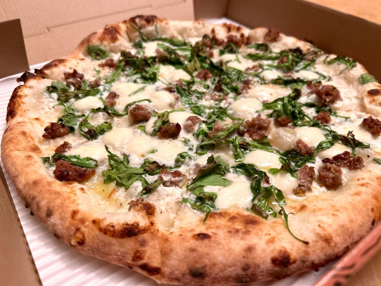 The Bianca pizza at Anodyne's Bay View coffee shop features a white sauce, mozzarella, arugula and Italian sausage.