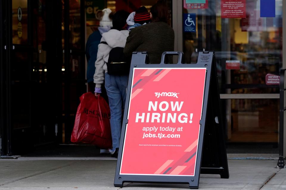 A hiring sign is displayed outside of a retail store in Vernon Hills, Ill., Saturday, Nov. 13, 2021.