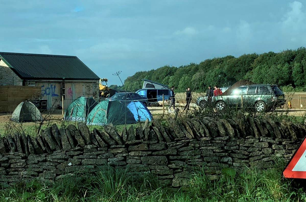 Protestors camped outside of Jereny Clarkson’s Diddly Squat Farm Shop, whoch they have hund banners on and spray painted. September 28 2021.   See SWNS story SWSYclarkson. Jeremy Clarkson's Farm has been 