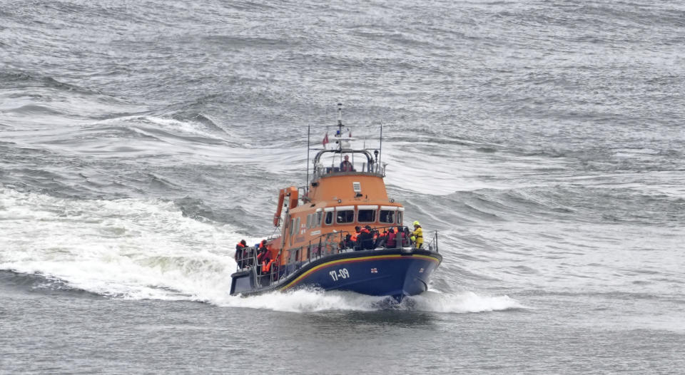 A group of people thought to be migrants are brought in to Dover, Kent, by the Border Force following a small boat incident in the Channel, on Tuesday April 23, 2024. Prime Minister Rishi Sunak said "nothing will stand in our way" of getting flights to Rwanda off the ground, as the Government braced itself for legal challenges to the scheme to send asylum seekers to the east African country. (Gareth Fuller/PA via AP)