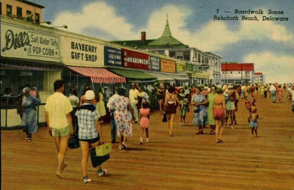 A view of the Rehoboth Beach boardwalk with the Belhaven Hotel in the distance in an undated postcard.